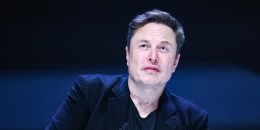 Elon Musk looks up