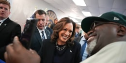 ice President Kamala Harris greets audience members at a campaign rally at United Auto Workers Local 900 on Aug. 8, 2024 in Wayne, Mich.