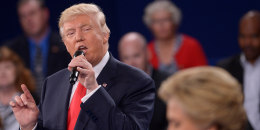 Donald Trump and Hilary Clinton participate in a town hall debate in St. Louis, Missouri, on October 9, 2016. 