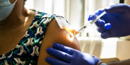 A woman receives a covid vaccine