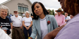 Angela Alsobrooks shakes hands with a supporter
