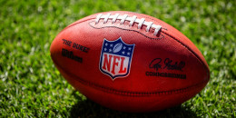 A close up view of a Wilson The Duke game football on the field during the second quarter of a game between the Denver Broncos and the Washington Commanders at Empower Field at Mile High on September 17, 2023 in Denver, Colorado. 