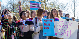 Teens with banners.