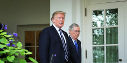 Donald Trump and Mitch McConnell walk into the Rose Garden