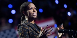 Michelle Obama speaks at a podium