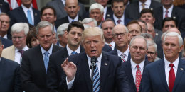 President Donald Trump is flanked by House Republicans after they passed legislation aimed at repealing and replacing ObamaCare 