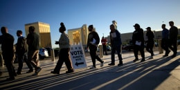 People line up to vote outside Allegiant Stadium in Las Vegas