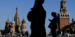 Silhouettes of people walking in a city