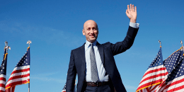 Image: stephen miller politics political wave hand gesture smile