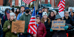 Activists hold rally outside White House.