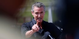 Gavin Newsom  pointing as he speaks.