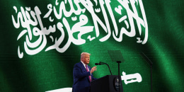 President Donald J. Trump stands at a lectern on stage and addresses