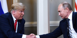 Russian President Vladimir Putin and US President Donald Trump shake hands.