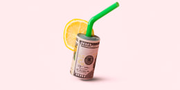 Money concept with a stack of banknotes as a cocktail, vacation, rest