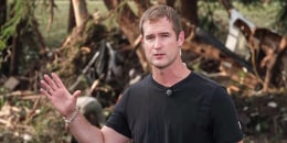 Morgan Chesky speaks outside in the forest near flood debris