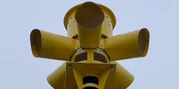 A triptych showing siren at the Comfort Volunteer Fire Department headquarters and siren installed in a park near Cypress Creek.