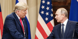 President Donald Trump and Russian President Vladimir Putin shae hands