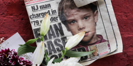 A newspaper with a photograph of Etan Patz on a makeshift memorial