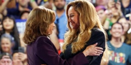 Beyonce and Kamala Harris embrace at a campaign rally.