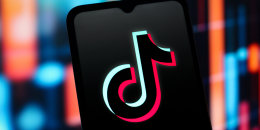 The TikTok logo displayed on a smartphone screen. 