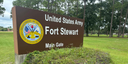 A sign outside that says "United States Army Fort Stewart"