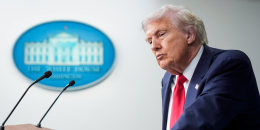 Donald Trump stands at a podium