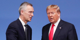 Jens Stoltenberg and Donald Trump shake hands