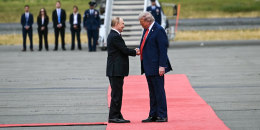 Image: President Donald Trump greets Russian President Vladimir Putin