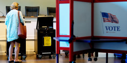 A voter casts their ballot
