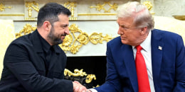 Volodymyr Zelenskyy, left, and Donald Trump shake hands