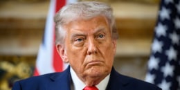 Donald Trump standing at a press conference 
