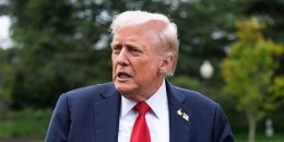 Donald Trump walks outside while speaking and pointing