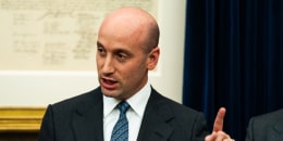 Stephen Miller speaks and points