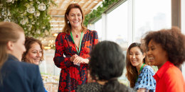 Senior businesswoman giving speech at business conference