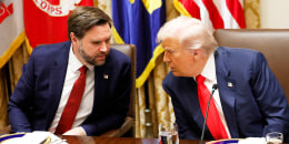 U.S. President Donald Trump speaks with U.S. Vice President JD Vance.