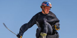 Freestyle skier Mac Forehand practices a switch triple cork 1980 mute while jumping onto an airbag