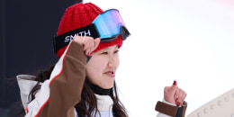 Bea Kim poses for her portrait to be taken while wearing snowboard attire. 