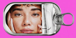 A woman's face inside an empty tin sardine can.
