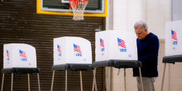 A person caste their vote.