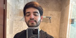 Cesar Gastelum takes a selfie in a bathroom mirror