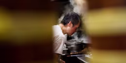 Image: Mr. Chan cooks at Jade Garden Restaurant in Seattle's Chinatown-International District, as the business moves to takeout-only due to new state restaurant requirements during the outbreak of coronavirus disease (COVID-19), in Seattle