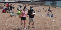 Masks have become a common sight on beaches as attractions reopen during the coronavirus pandemic.