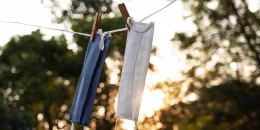 Washable protective fabric face masks on the wash line outdoors