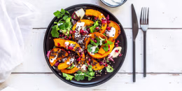 Autumnal salad with fried pumpkin, lentils, radicchio, pomegranate seeds, leaf salad and parsley with dressing