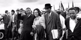 Dr. Martin Luther King Jr., and his wife, Coretta Scott King, lead off the final lap to the state capitol at Montgomery, Ala., on March 25, 1965. Thousands of civil rights marchers joined in the walk, which began in Selma, Ala., on March 21, demanding voter registration rights for blacks. Rev. D.F. Reese, of Selma, is at right. (AP Photo)
