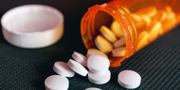 Pills and orange pill bottle