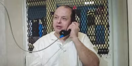 Robert Roberson speaks on the phone in jail