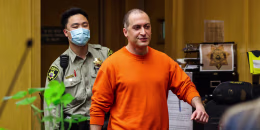 Nima Momeni walks into the courtroom