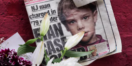 A newspaper with a photograph of Etan Patz on a makeshift memorial