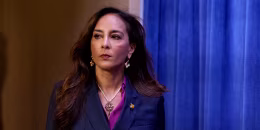 Harmeet Dhillon arrives for a news conference at the Justice Department.